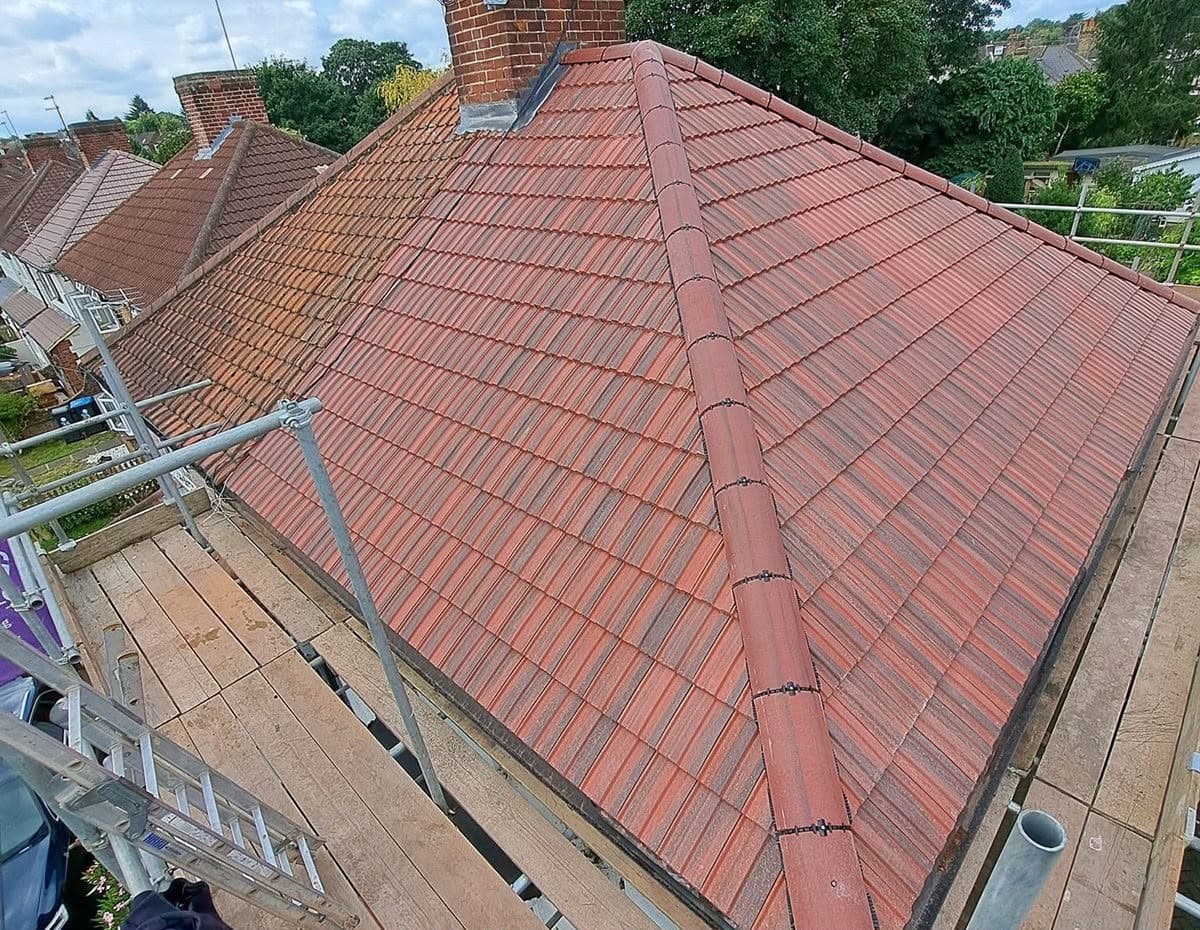 Completed re-roof with new interlocking roof tiles and ridge line